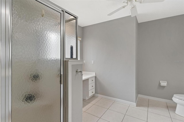 5971 Brittania Blvd, Tavares, FL 32778 - bathroom with tile patterned flooring, a ceiling fan, a stall shower, and vanity