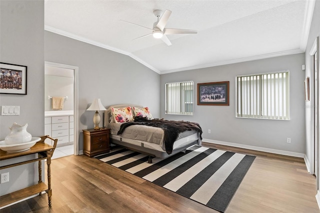 5971 Brittania Blvd, Tavares, FL 32778 - bedroom featuring ornamental molding, lofted ceiling, light wood-style floors, ceiling fan, and connected bathroom