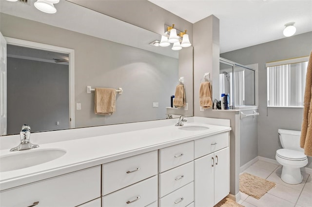 5971 Brittania Blvd, Tavares, FL 32778 - bathroom featuring double vanity, tile patterned floors, and a shower with door