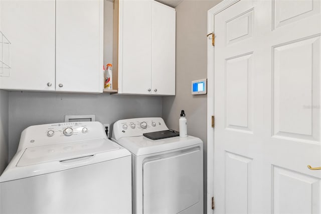 5971 Brittania Blvd, Tavares, FL 32778 - laundry area featuring cabinet space and washing machine and clothes dryer