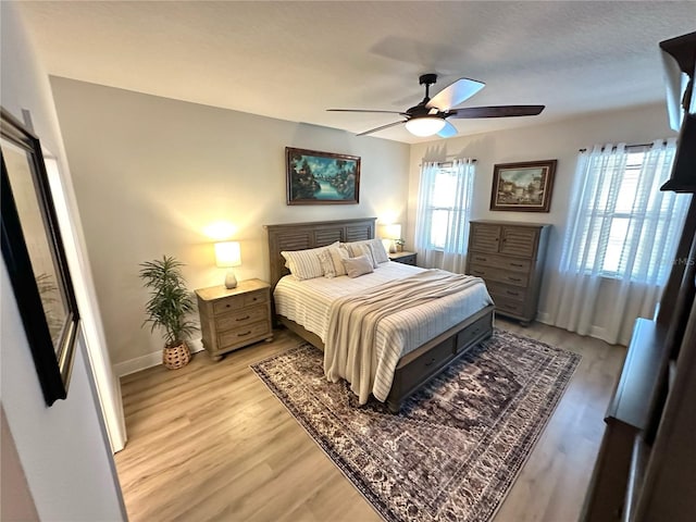 384 Summer Squall Rd, Davenport, FL 33837 - bedroom featuring light wood-type flooring and a ceiling fan
