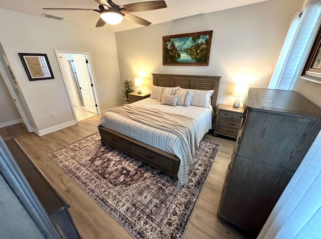 384 Summer Squall Rd, Davenport, FL 33837 - bedroom featuring light wood-style floors and a ceiling fan