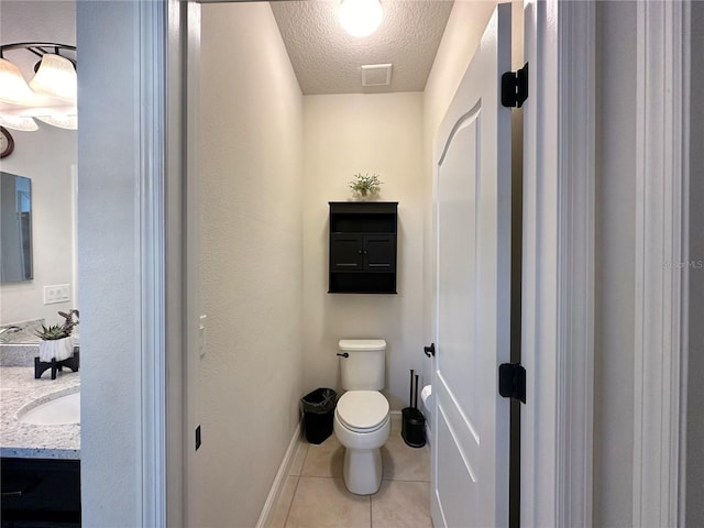 384 Summer Squall Rd, Davenport, FL 33837 - bathroom featuring vanity, a textured ceiling, and tile patterned flooring