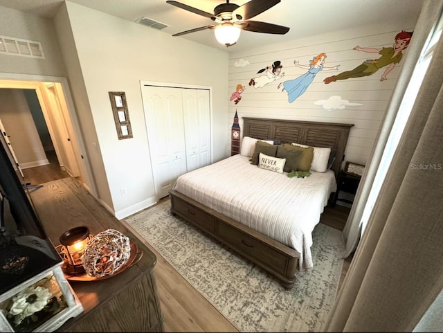 384 Summer Squall Rd, Davenport, FL 33837 - bedroom featuring wood finished floors, a closet, and ceiling fan
