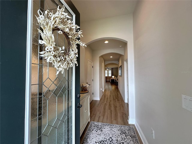 384 Summer Squall Rd, Davenport, FL 33837 - corridor with arched walkways, light wood-style floors, and recessed lighting