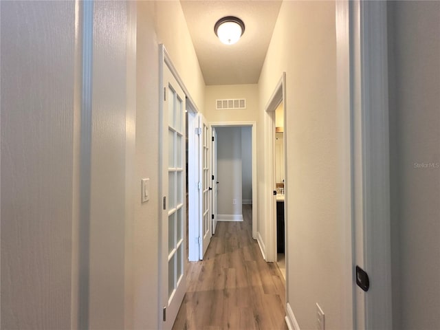 384 Summer Squall Rd, Davenport, FL 33837 - hallway featuring wood finished floors and baseboards
