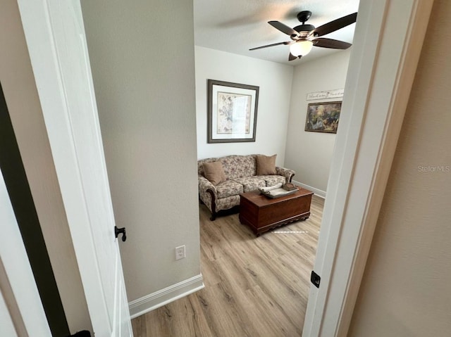 384 Summer Squall Rd, Davenport, FL 33837 - living area with light wood-style flooring and ceiling fan