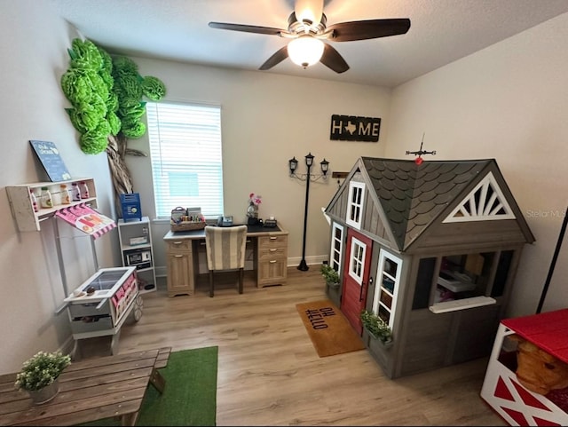 384 Summer Squall Rd, Davenport, FL 33837 - rec room with light wood finished floors, a ceiling fan, and an office area