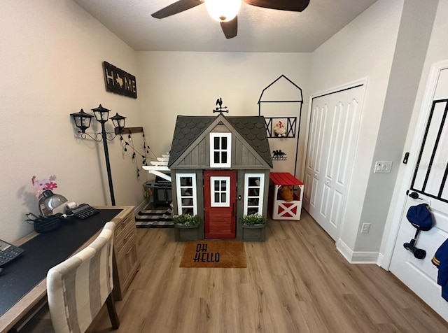 384 Summer Squall Rd, Davenport, FL 33837 - recreation room with light wood-type flooring and ceiling fan