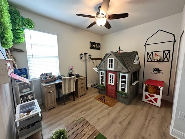 384 Summer Squall Rd, Davenport, FL 33837 - home office with light wood-style floors and a ceiling fan