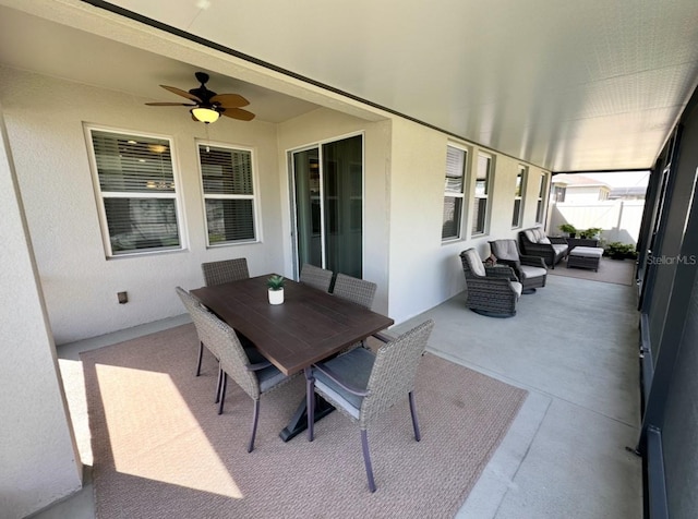 384 Summer Squall Rd, Davenport, FL 33837 - sunroom / solarium featuring a ceiling fan, an outdoor hangout area, and outdoor dining space