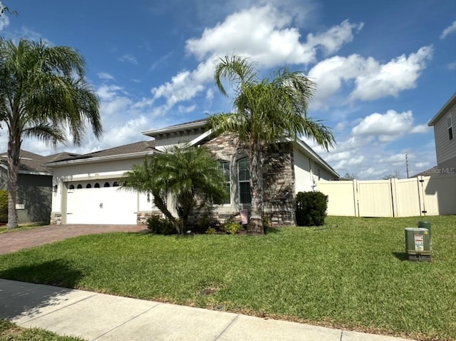 384 Summer Squall Rd, Davenport, FL 33837 - view of front of property with driveway, an attached garage, and stucco siding