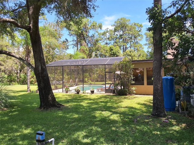 29205 Old Ml E, Tavares, FL 32778 - view of green lawn featuring an outdoor pool and glass enclosure