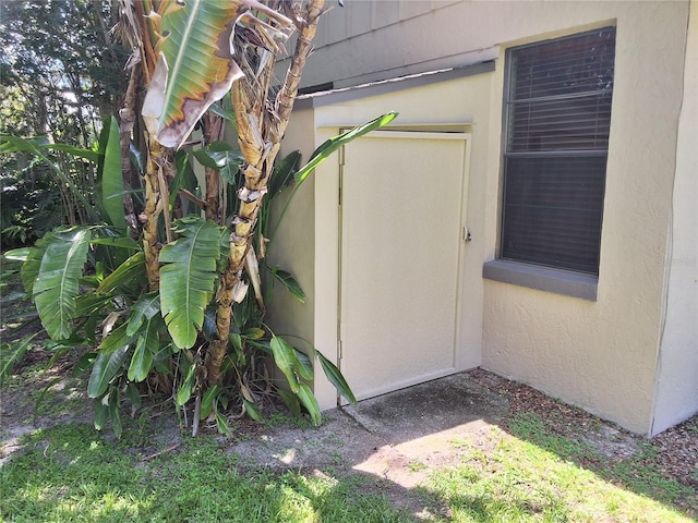 29205 Old Ml E, Tavares, FL 32778 - doorway to property with stucco siding