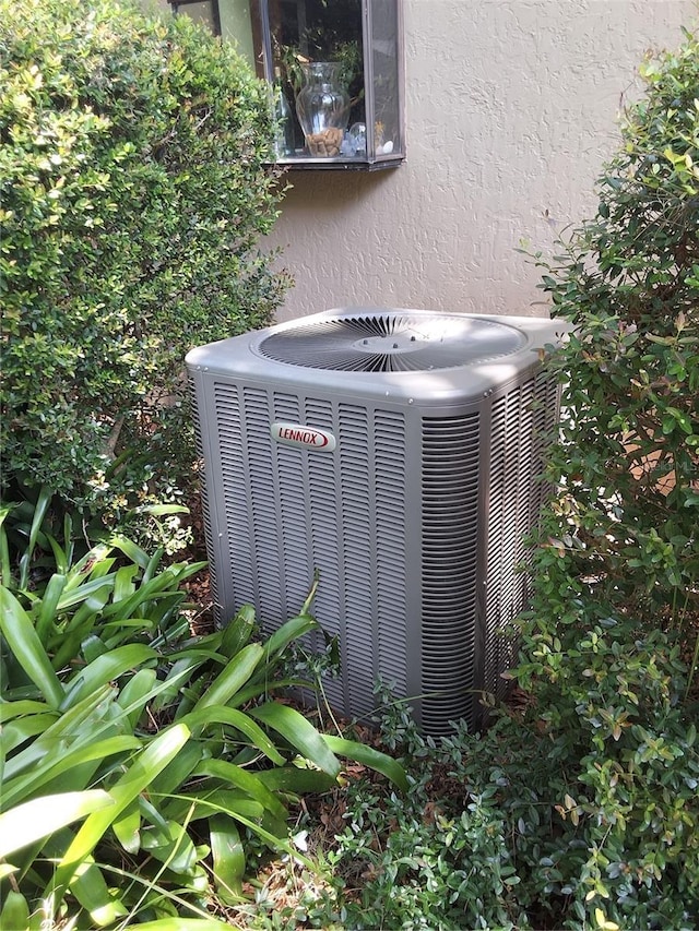 29205 Old Ml E, Tavares, FL 32778 - exterior view of a central AC unit and stucco siding