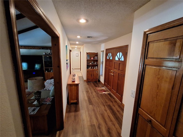 29205 Old Ml E, Tavares, FL 32778 - foyer entrance featuring a textured ceiling, dark wood finished floors, and recessed lighting