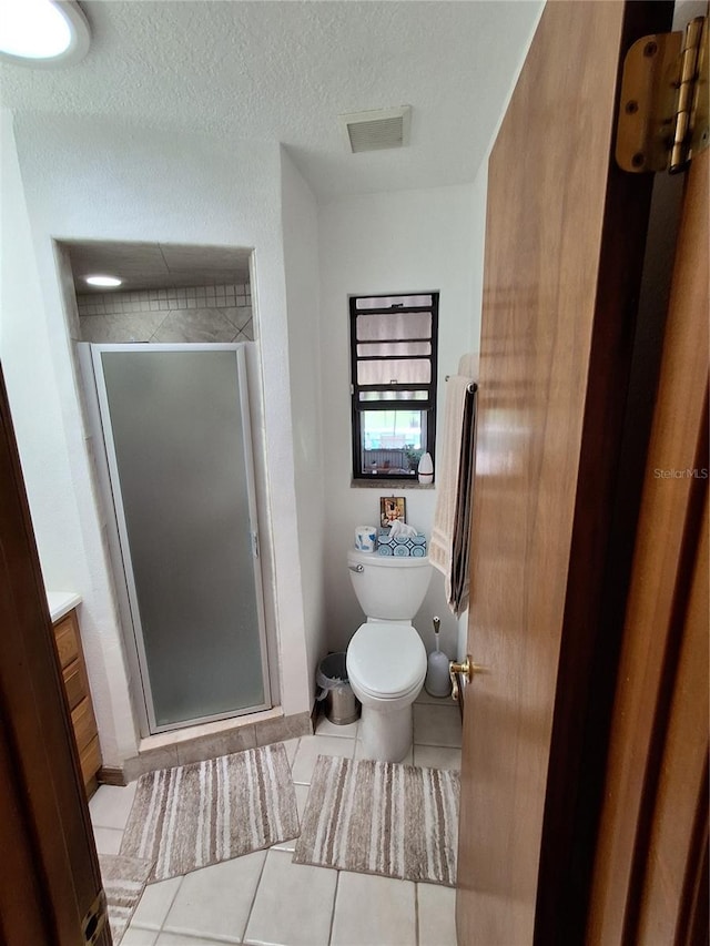 29205 Old Ml E, Tavares, FL 32778 - full bath with tile patterned flooring, a shower stall, vanity, and a textured ceiling