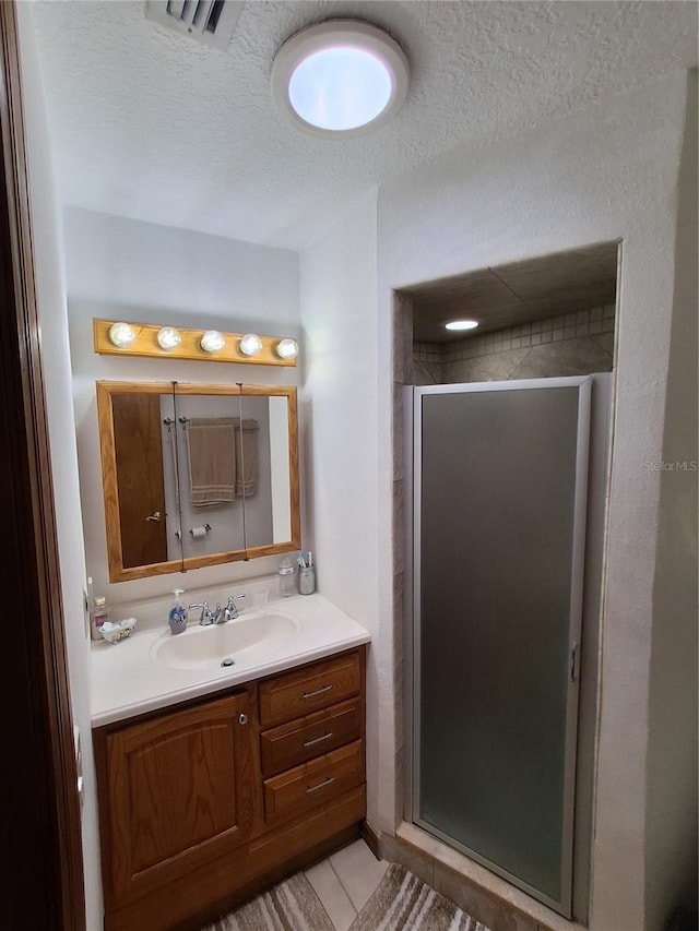 29205 Old Ml E, Tavares, FL 32778 - full bathroom with vanity, a shower stall, and a textured ceiling