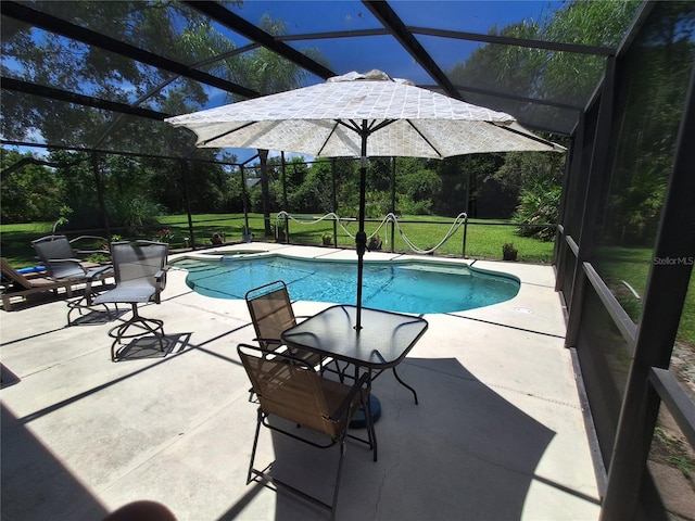 29205 Old Ml E, Tavares, FL 32778 - view of pool featuring glass enclosure, a patio, a pool with connected hot tub, and a yard