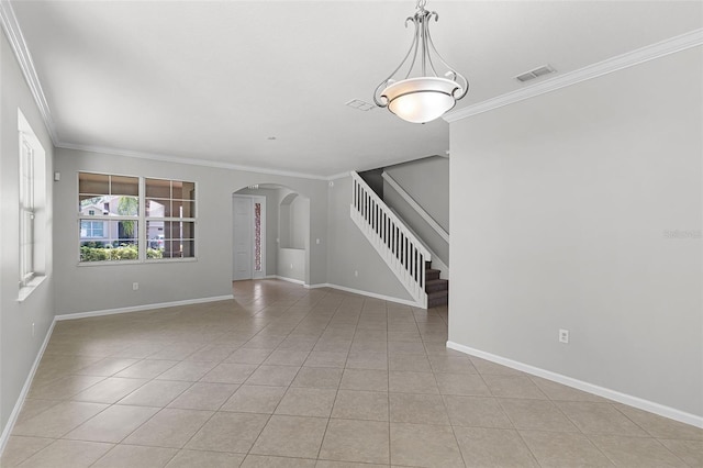 15604 Starlite St, Clermont, FL 34714 - unfurnished room with arched walkways, stairway, light tile patterned flooring, and ornamental molding