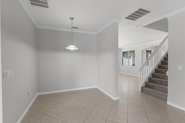 15604 Starlite St, Clermont, FL 34714 - unfurnished room featuring crown molding, light tile patterned floors, arched walkways, and stairs