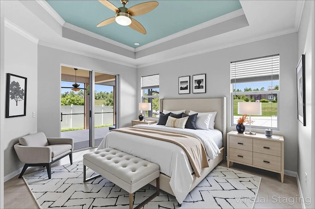 15604 Starlite St, Clermont, FL 34714 - bedroom featuring a raised ceiling, access to outside, light tile patterned flooring, ornamental molding, and a ceiling fan