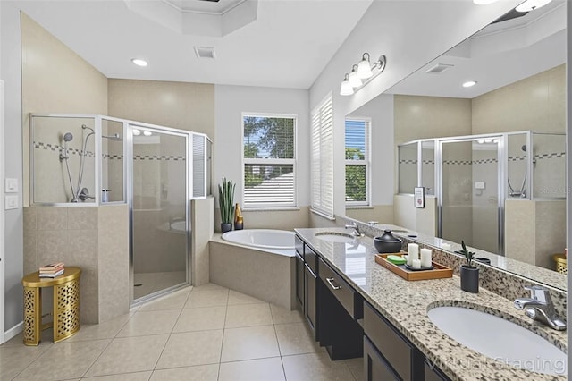15604 Starlite St, Clermont, FL 34714 - bathroom with double vanity, a stall shower, a bath, and tile patterned flooring