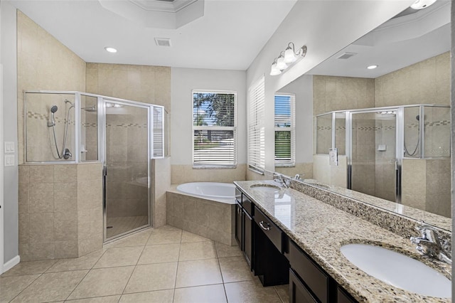 15604 Starlite St, Clermont, FL 34714 - bathroom with a bath, double vanity, a stall shower, tile patterned floors, and recessed lighting