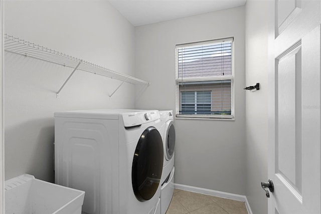15604 Starlite St, Clermont, FL 34714 - washroom with washing machine and dryer and light tile patterned floors