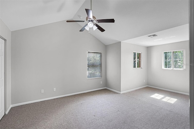 15604 Starlite St, Clermont, FL 34714 - carpeted empty room with vaulted ceiling and ceiling fan