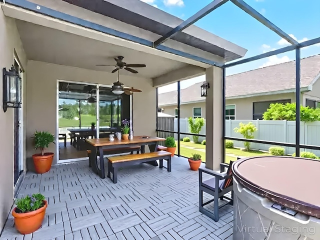 15604 Starlite St, Clermont, FL 34714 - sunroom / solarium with ceiling fan and outdoor dining area