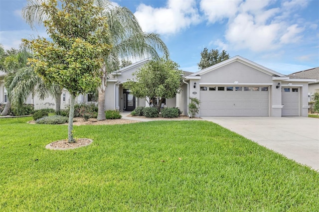 3681 Arlington Ridge Blvd, Leesburg, FL 34748 - view of front of home featuring a garage, driveway, stucco siding, and a front lawn