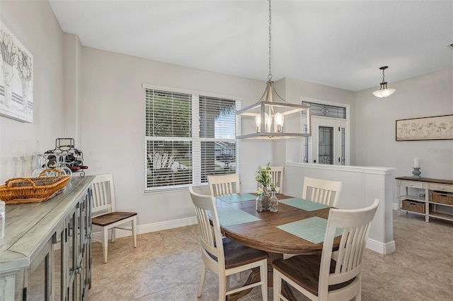 3681 Arlington Ridge Blvd, Leesburg, FL 34748 - dining space with a chandelier and baseboards