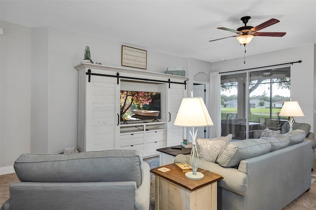3681 Arlington Ridge Blvd, Leesburg, FL 34748 - living area with a barn door and a ceiling fan