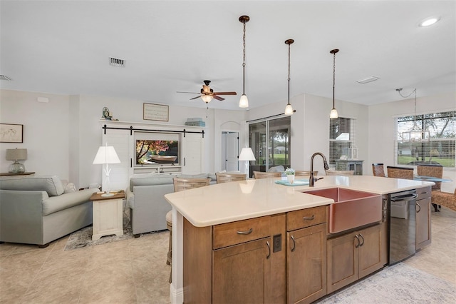 3681 Arlington Ridge Blvd, Leesburg, FL 34748 - kitchen with open floor plan, dishwasher, a center island with sink, light countertops, and ceiling fan