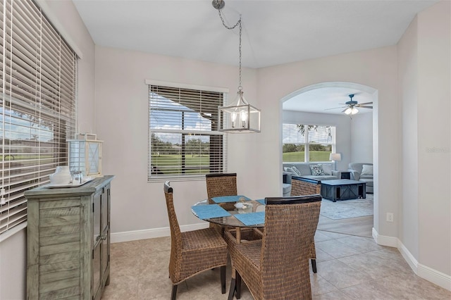 3681 Arlington Ridge Blvd, Leesburg, FL 34748 - dining area featuring arched walkways, ceiling fan, and light tile patterned floors