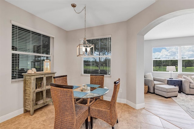 3681 Arlington Ridge Blvd, Leesburg, FL 34748 - dining room with arched walkways and light tile patterned flooring