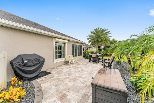 3750 Raspberry Ct, The Villages, FL 32163 - view of patio featuring grilling area and outdoor dining area