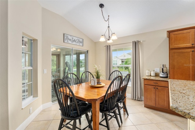 3750 Raspberry Ct, The Villages, FL 32163 - dining room with lofted ceiling, light tile patterned floors, and a chandelier