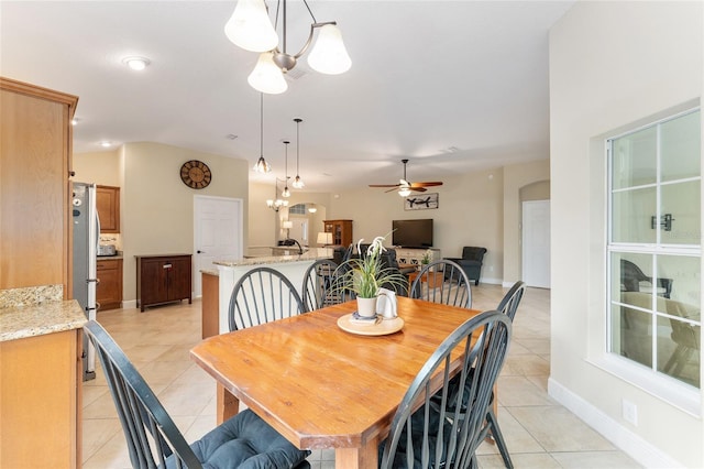 3750 Raspberry Ct, The Villages, FL 32163 - dining room featuring light tile patterned floors, ceiling fan, and a chandelier