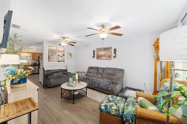 149 Shiloh Ave, Lady Lake, FL 32159 - living area with a ceiling fan and wood finished floors