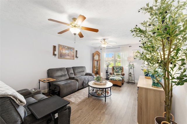 149 Shiloh Ave, Lady Lake, FL 32159 - living room with light wood-type flooring, ceiling fan, and a textured ceiling