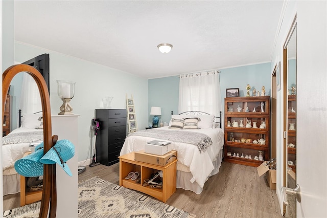 149 Shiloh Ave, Lady Lake, FL 32159 - bedroom with light wood-style floors and crown molding