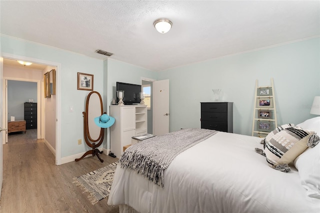 149 Shiloh Ave, Lady Lake, FL 32159 - bedroom featuring wood finished floors and crown molding