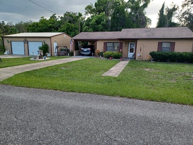 505 Richard St, Leesburg, FL 34748 - ranch-style house with a front yard, concrete driveway, a carport, and an outdoor structure