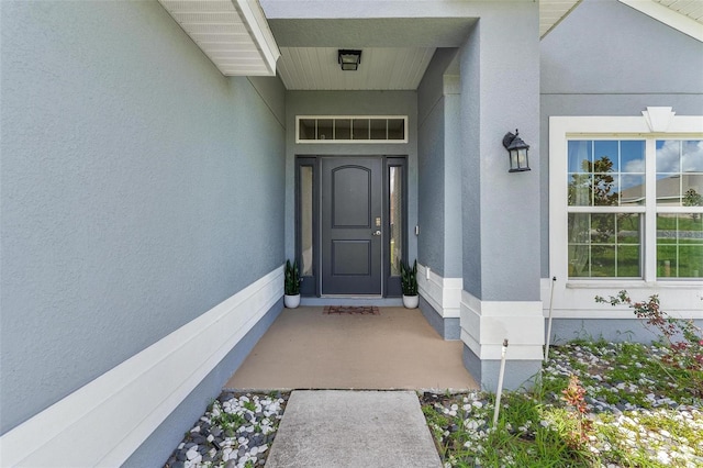7732 Sloewood Dr, Leesburg, FL 34748 - property entrance with stucco siding