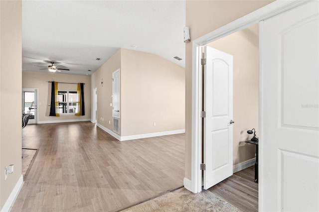 7732 Sloewood Dr, Leesburg, FL 34748 - hall featuring light wood-type flooring and baseboards