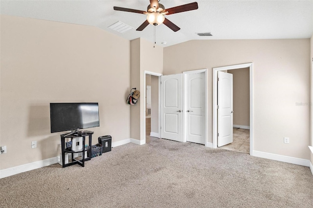 7732 Sloewood Dr, Leesburg, FL 34748 - carpeted living area with a ceiling fan and lofted ceiling