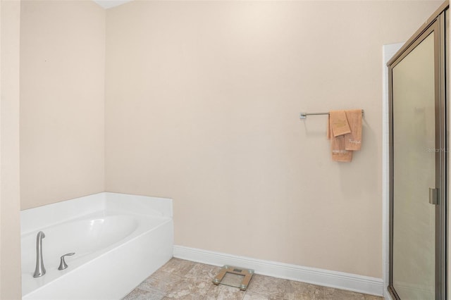 7732 Sloewood Dr, Leesburg, FL 34748 - full bath featuring a shower stall, a bath, and tile patterned flooring