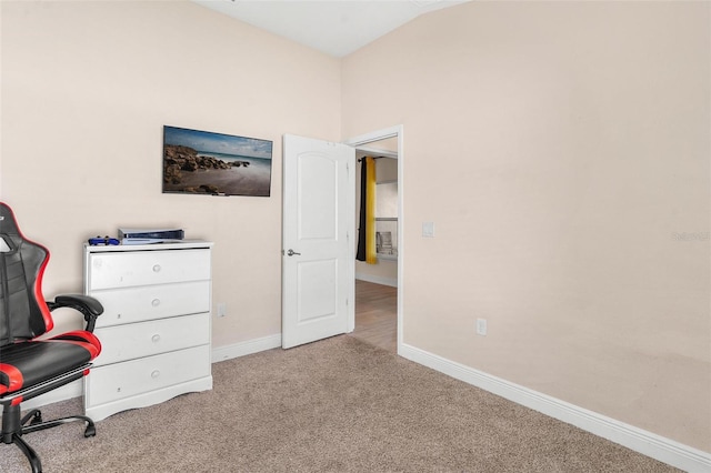 7732 Sloewood Dr, Leesburg, FL 34748 - bedroom with light colored carpet, an office area, and lofted ceiling